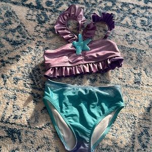 Disney’s three piece swimsuit inspired by the Little mermaid